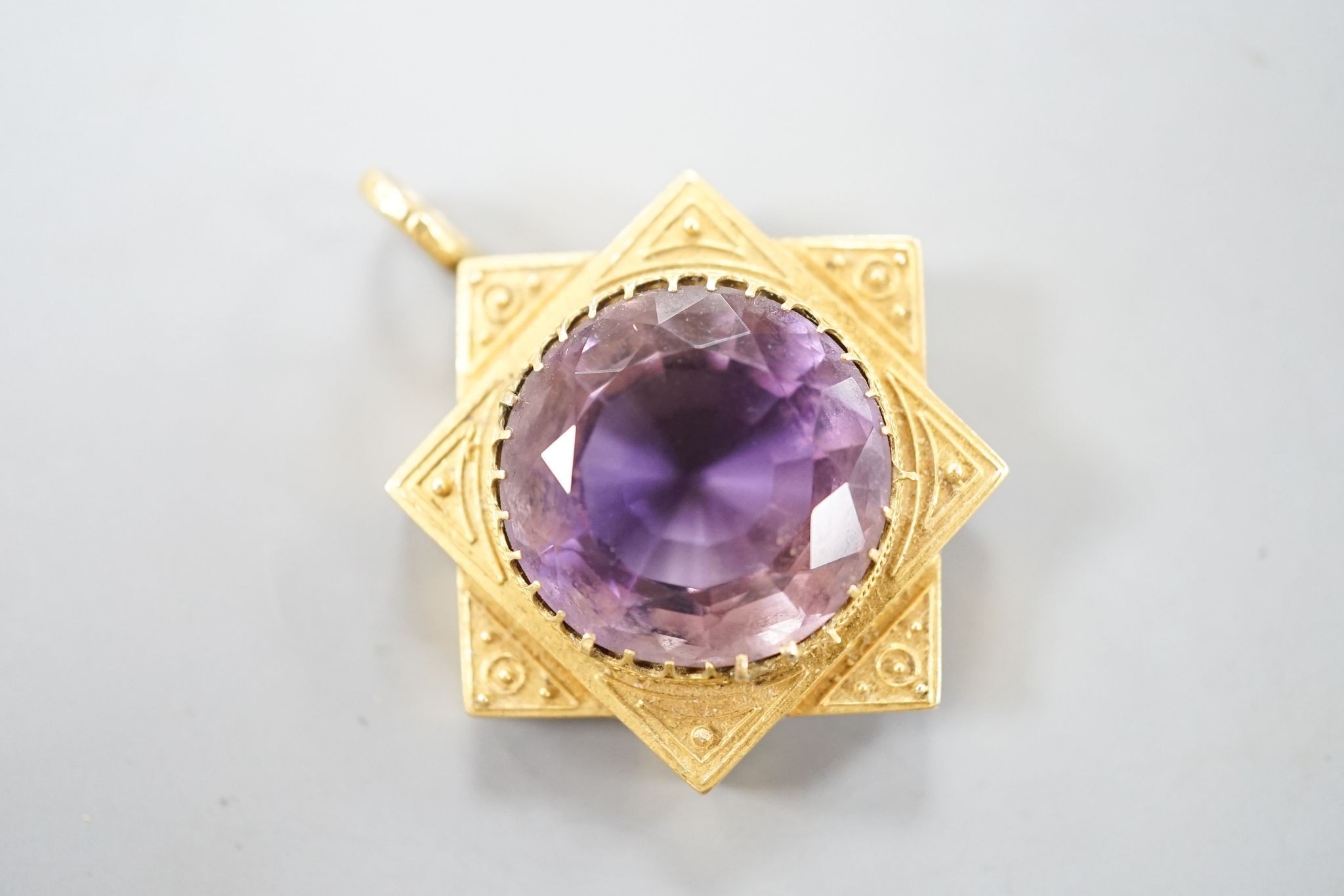 A late Victorian yellow metal and amethyst set pendant, 35mm, gross 7.5 grams.